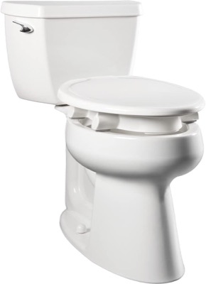 white elongated raised toilet seat with a closed lid sitting on a two-piece toilet