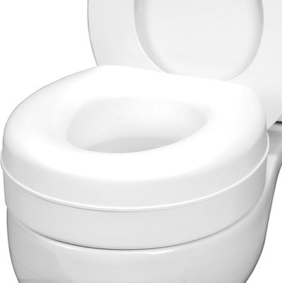 close view of a white round raised toilet seat riser sitting on a toilet bowl under an open lid